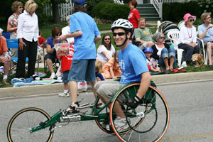 image of jason stubbeman in a wheelchair racing